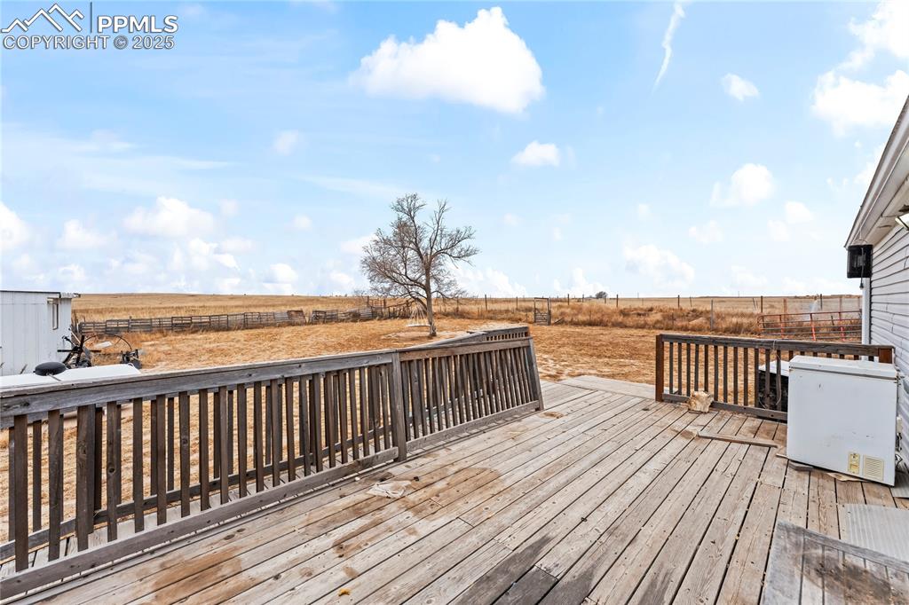Wooden deck with a view of rural / pastoral area