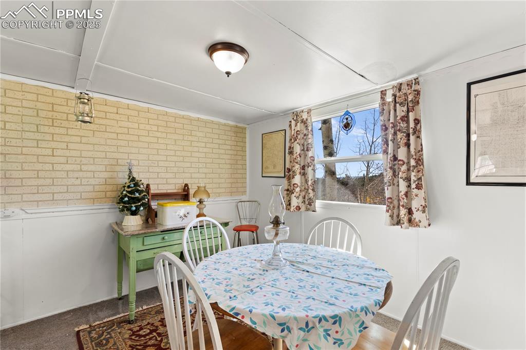 Dining space with brick wall