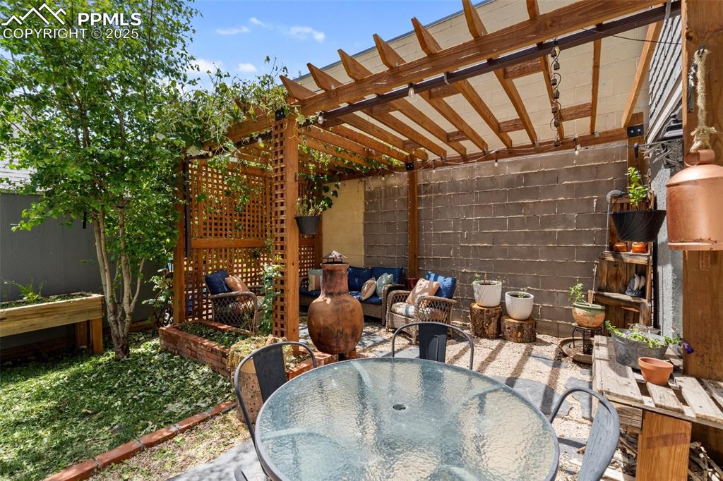 View of patio / terrace with outdoor dining area and a pergola
