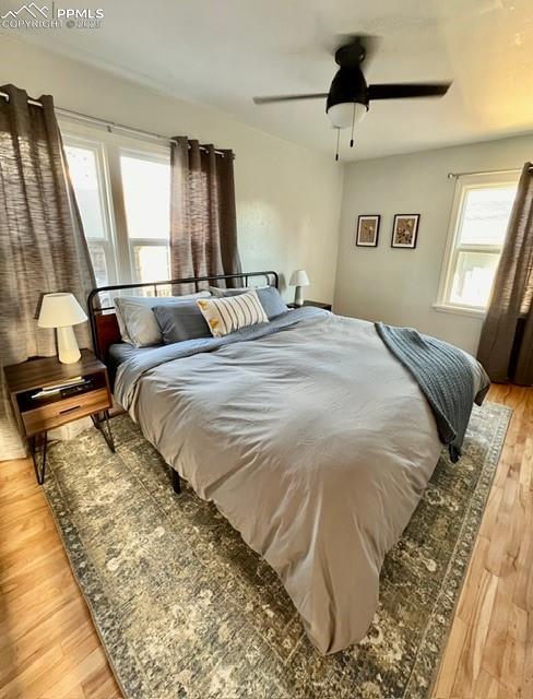 Bedroom featuring light wood flooring and ceiling fan