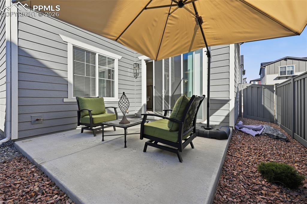 Concrete back patio with xeroscaping