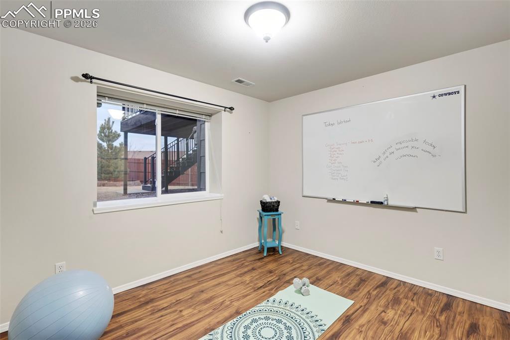 Exercise room with wood finished floors