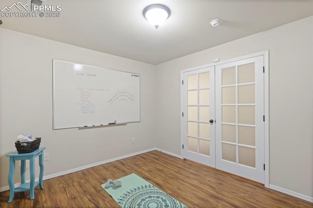 Office/Flex room with wood finished floors and french doors