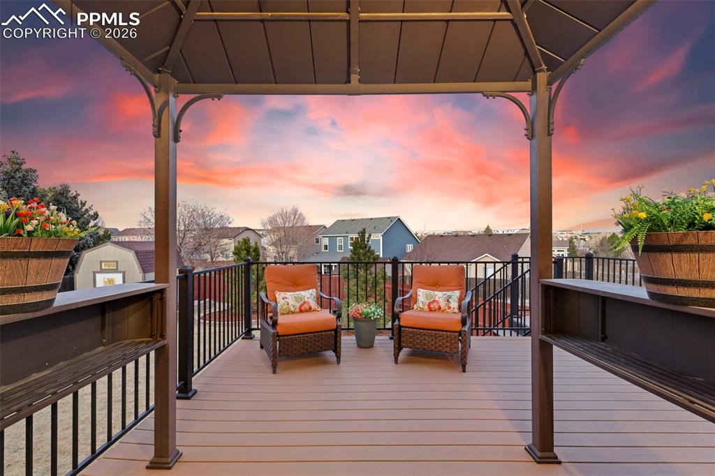 Deck with a gazebo and a residential view
