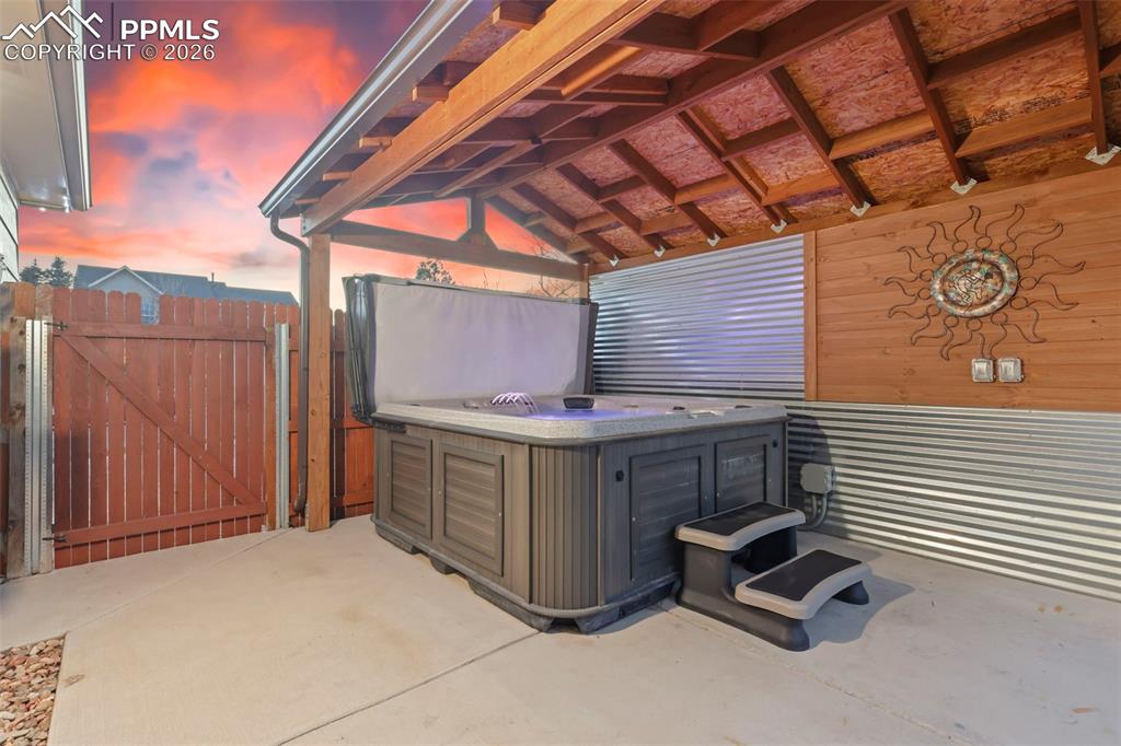 View of patio / terrace with a hot tub