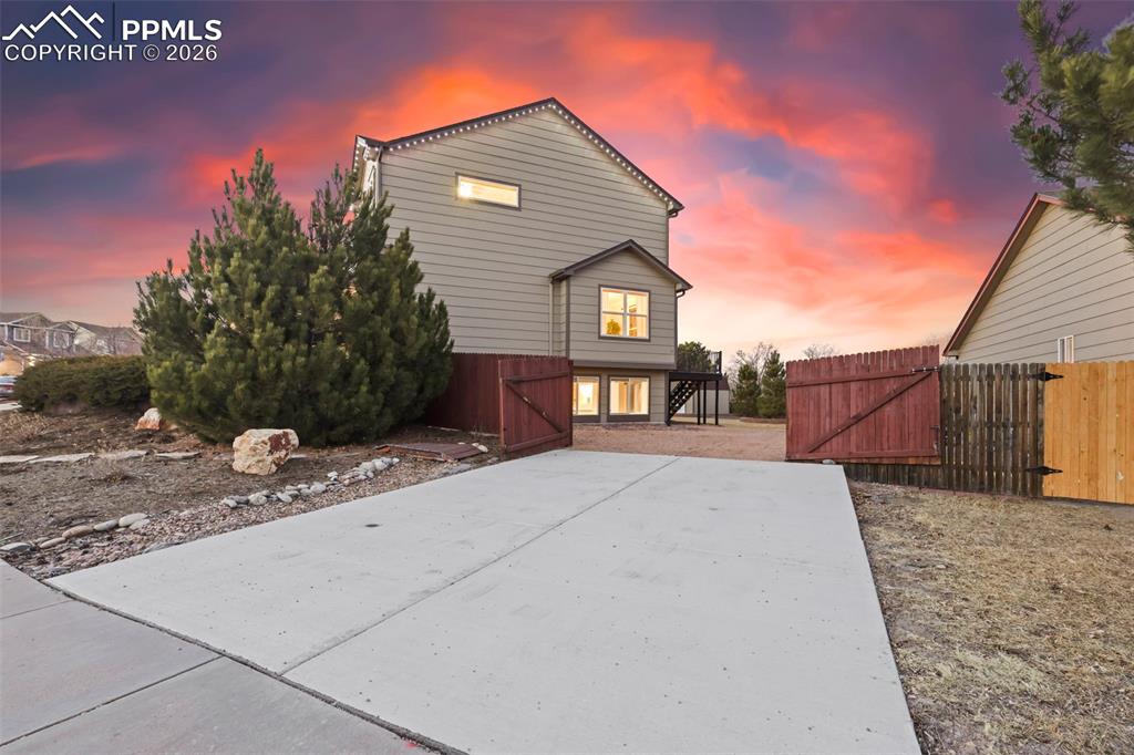 View of front of house featuring a gate & RV PArking