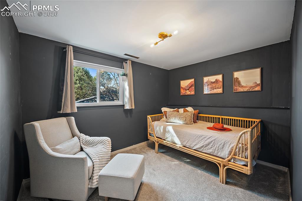 Basement bedroom with carpet and baseboards