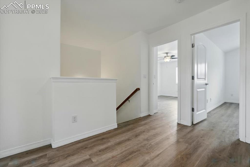 Empty room with wood finished floors and baseboards