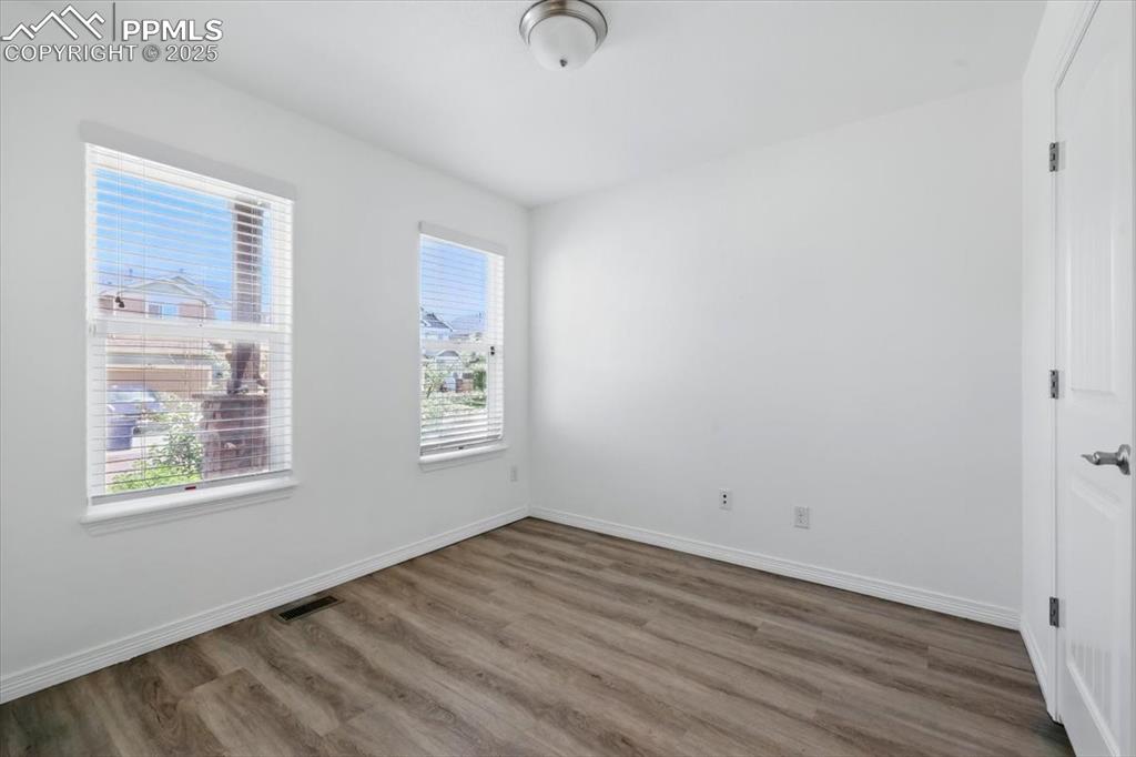 Office or dining space featuring wood finished floors and baseboards