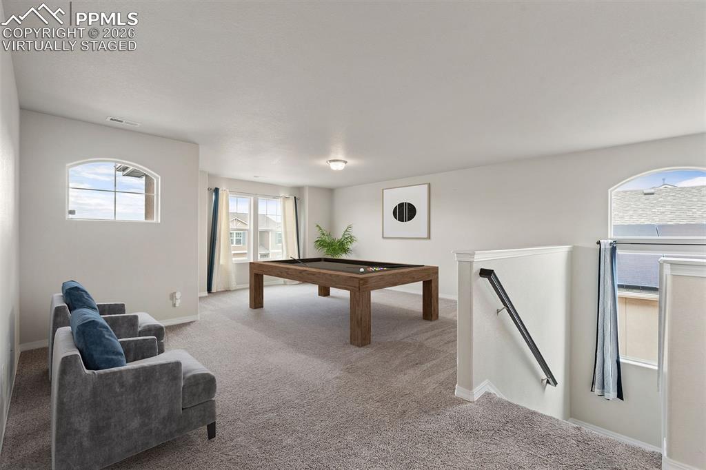 Virtually staged. Game room featuring carpet and pool table