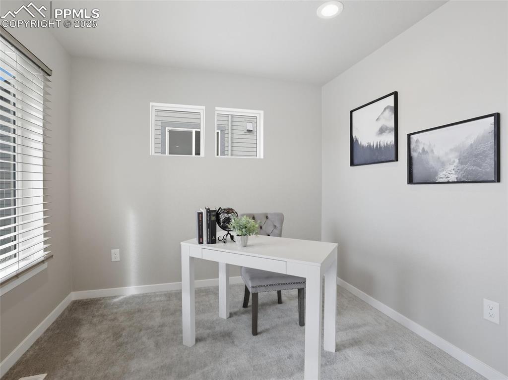 Main level home office/ flex space off of the kitchen.