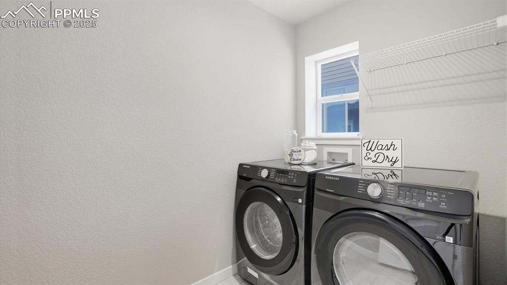Main level Laundry with window and Samsung washer and dryer.