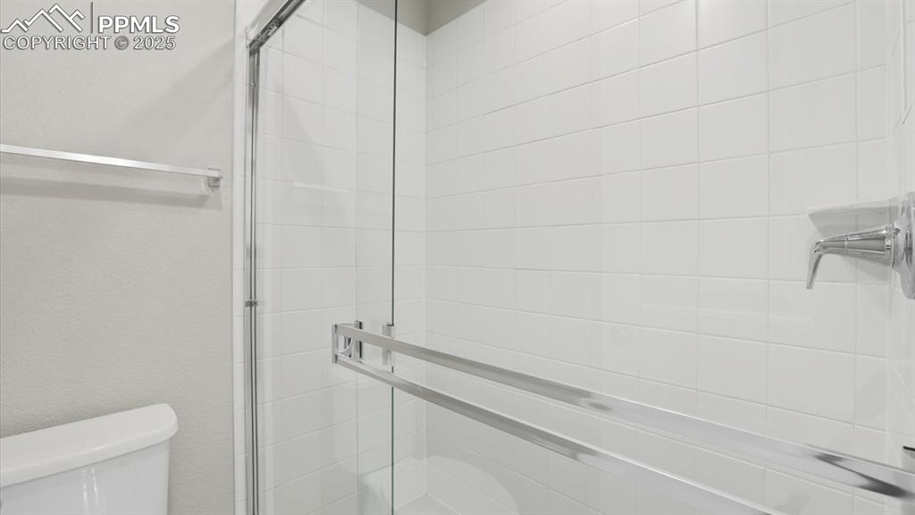 Tiled Shower in the front Bathroom.