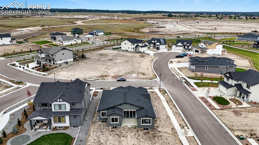 Aerial rear view of home and lot.