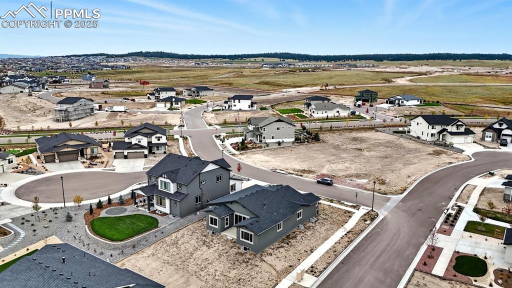 Aerial view of home and corner lot.