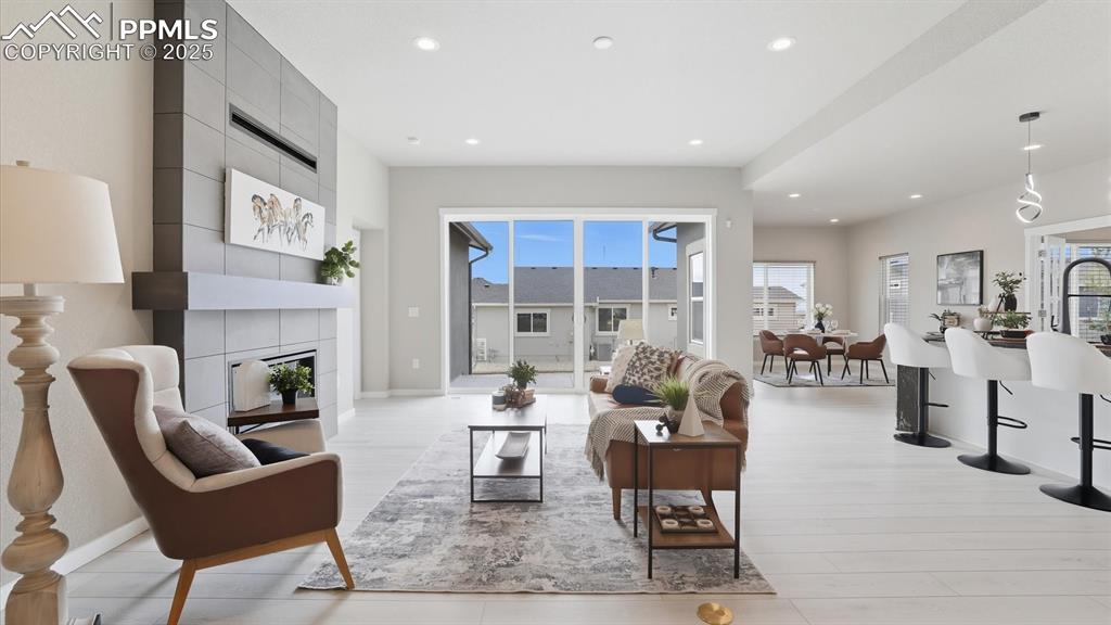 View of the Living Room, Dining Area, and Kitchen.