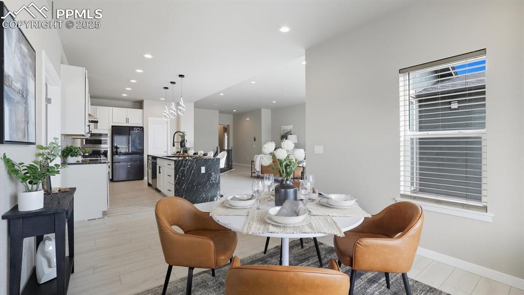 Dining Area into the Gourmet Kitchen.