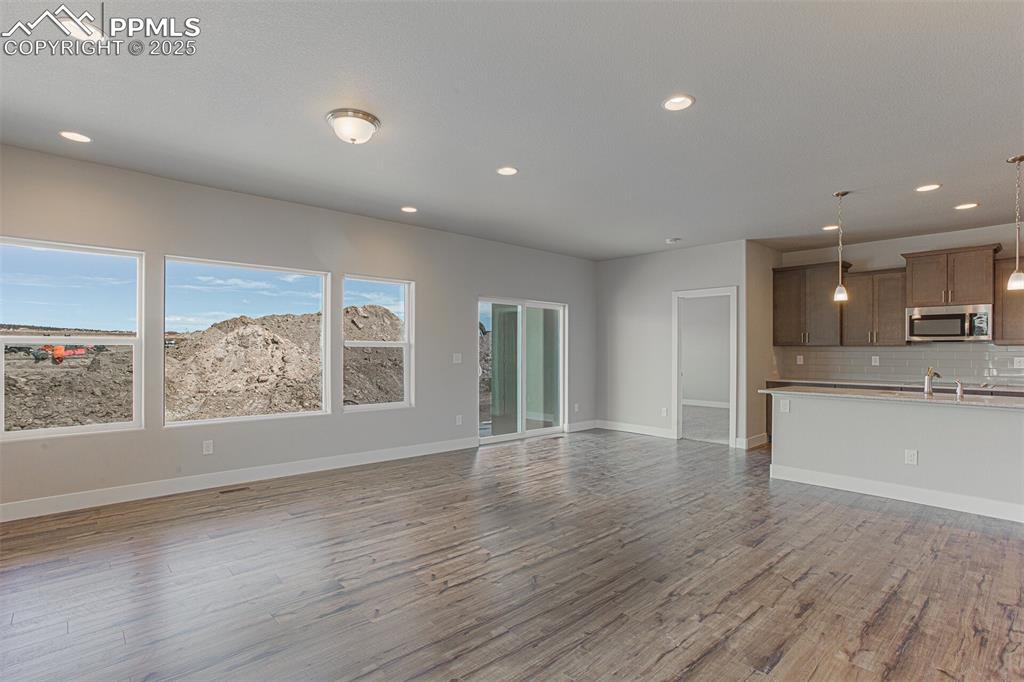 Unfurnished living room featuring recessed lighting and light wood finished floors