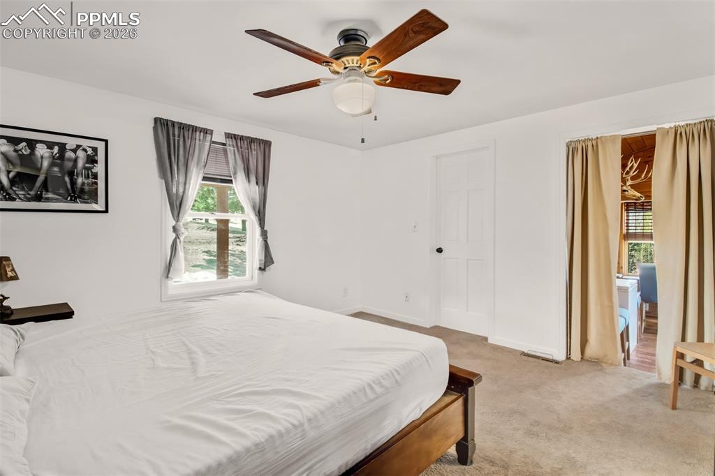 Primary bedroom with walk in closet, en suite bathroom and attached sitting room