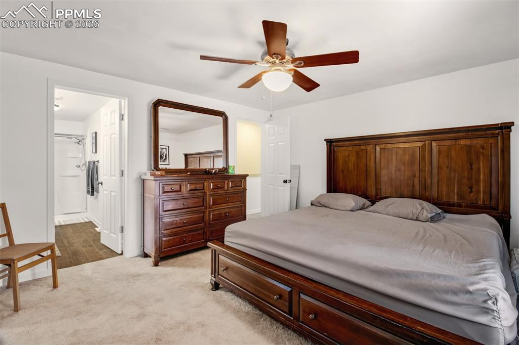 Primary bedroom with walk in closet, en suite bathroom and attached sitting room