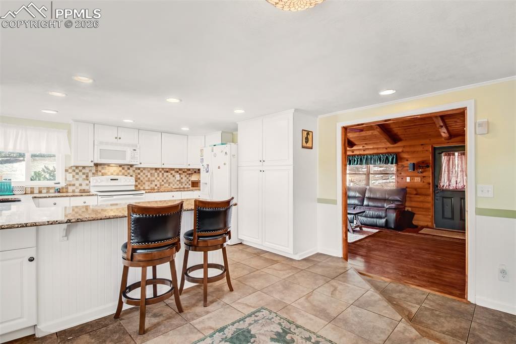 Breakfast area looking at the breakfast bar and kitchen