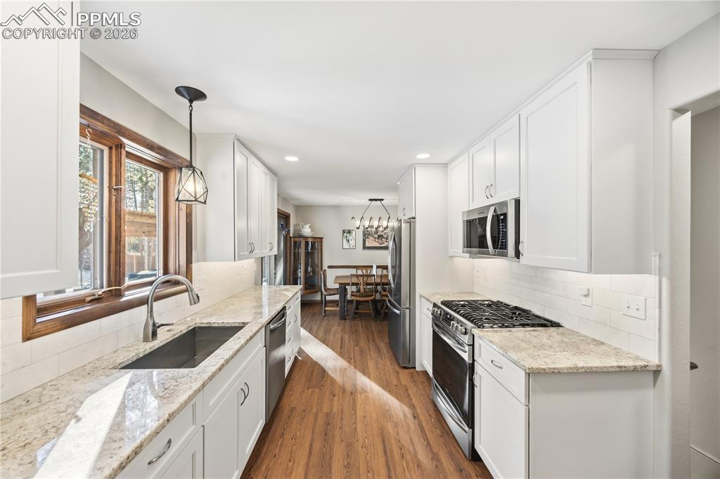 kitchen window overlooks the backyard