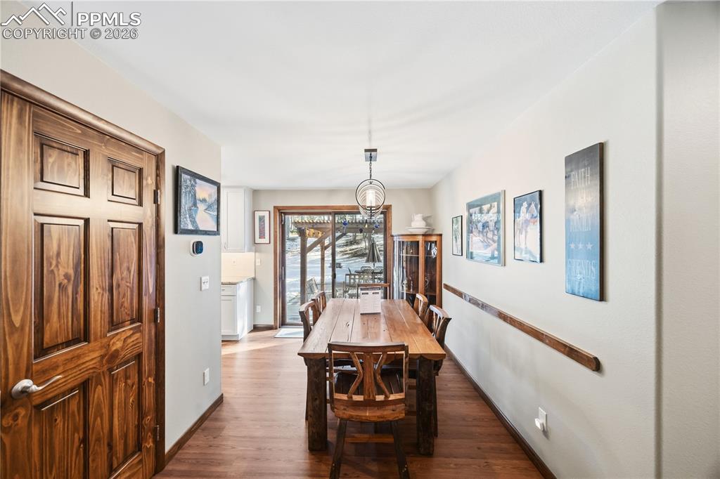 Coat closet to the left and dining room overlooking the backyard