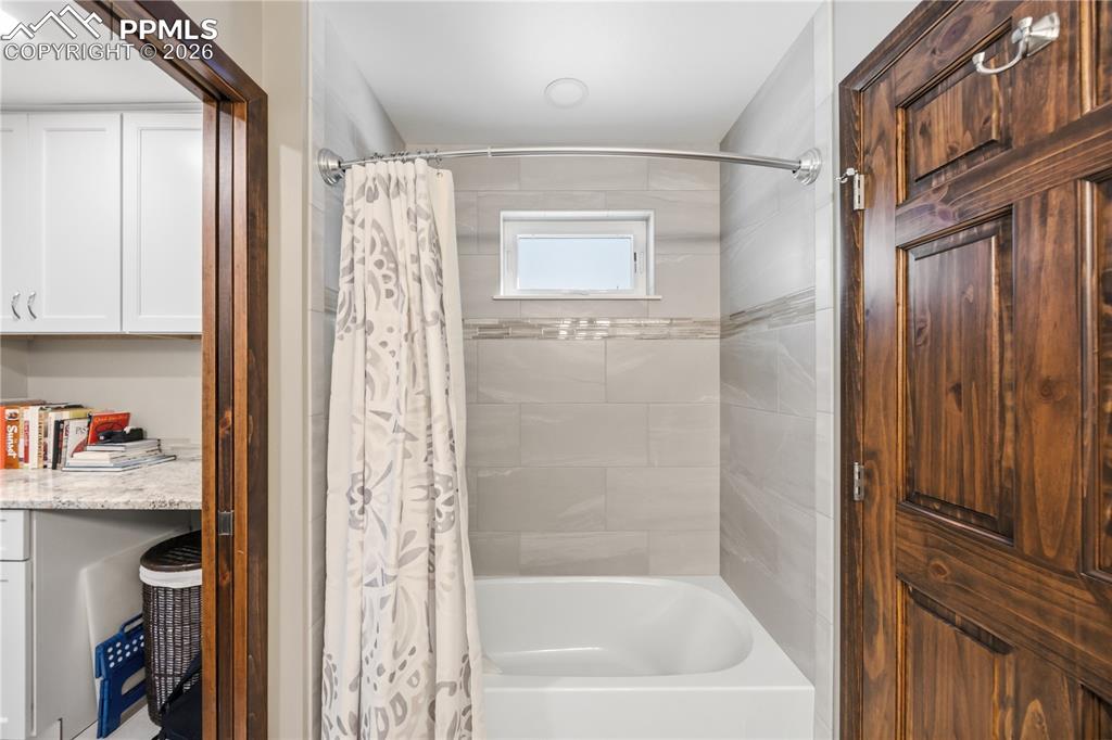 tile surround, window offers good natural lighting