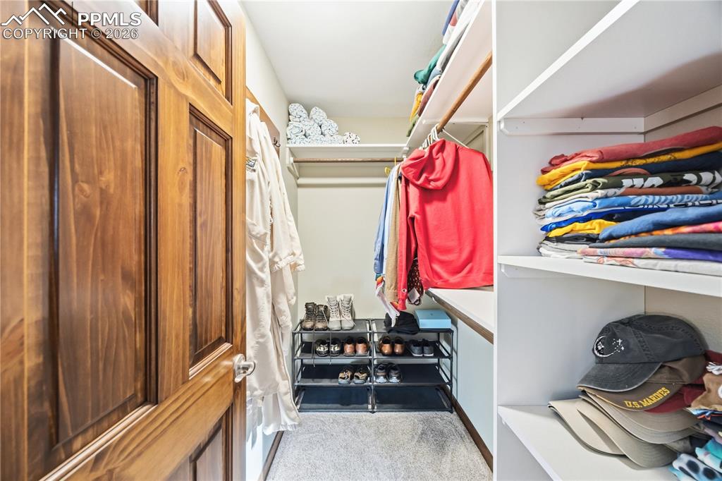 primary walk-in closet with built-in organizers