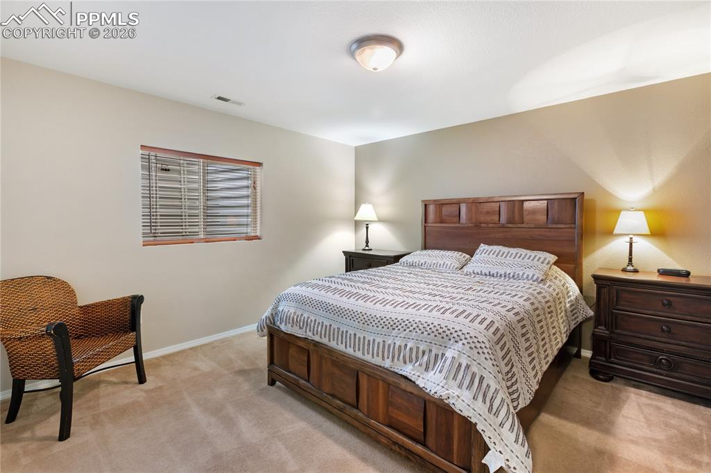 Bedroom with light carpet