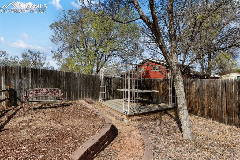 View of fenced backyard