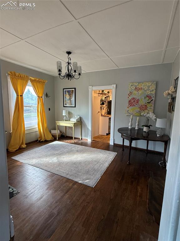 Dining space with a chandelier and wood finished floors