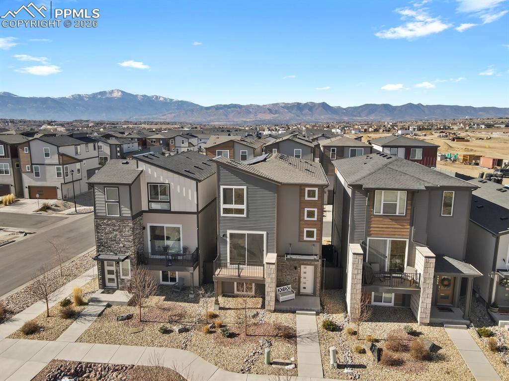 View of front of house with a residential view, a mountain view.