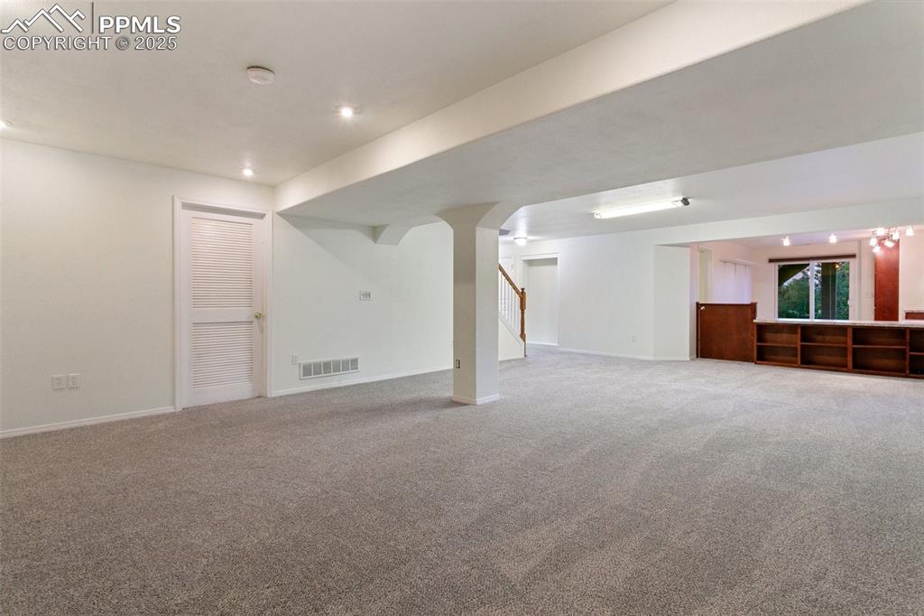 potential theater space with surround sound wiring and theater lights. 