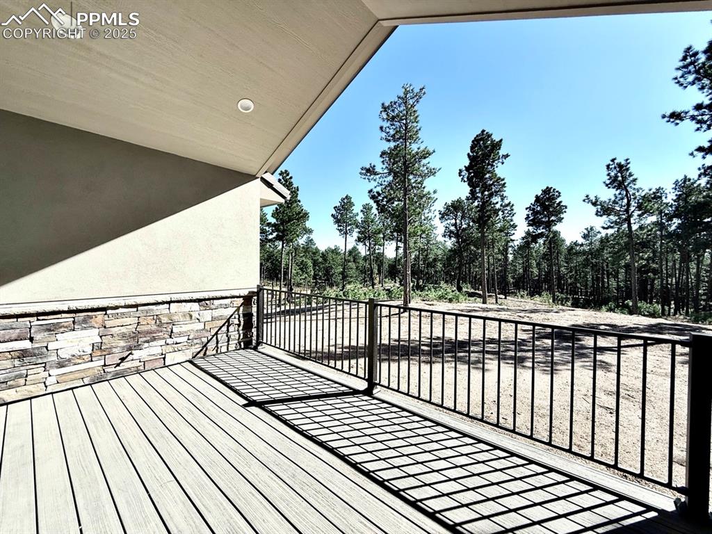Oversized Sliding Doors to the Covered Composite Deck, featuring a Natural Gas line for Grilling and a Hose Bib for watering your favorite plants as you enjoy the forested surroundings.