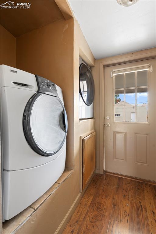 Laundry area featuring washer / clothes dryer and hardwood / wood-style floors