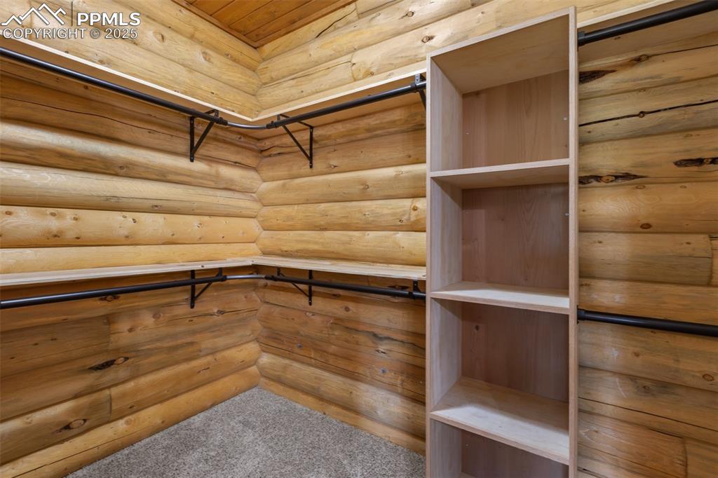 Walk in closet featuring carpet flooring