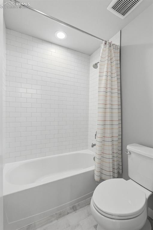 Full basement bathroom with tub/shower, vanity, and toilet - convenient for basement bedroom guests