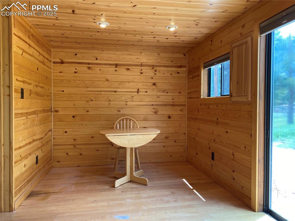 The dining room has maple hard wood flooring and lots of natural light