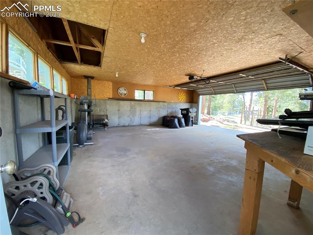 The 'other' garage comfortably fits 2 cars & offers extra storage