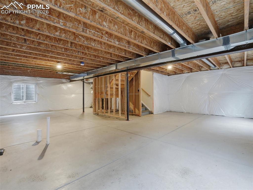 Unfinished basement with stairway