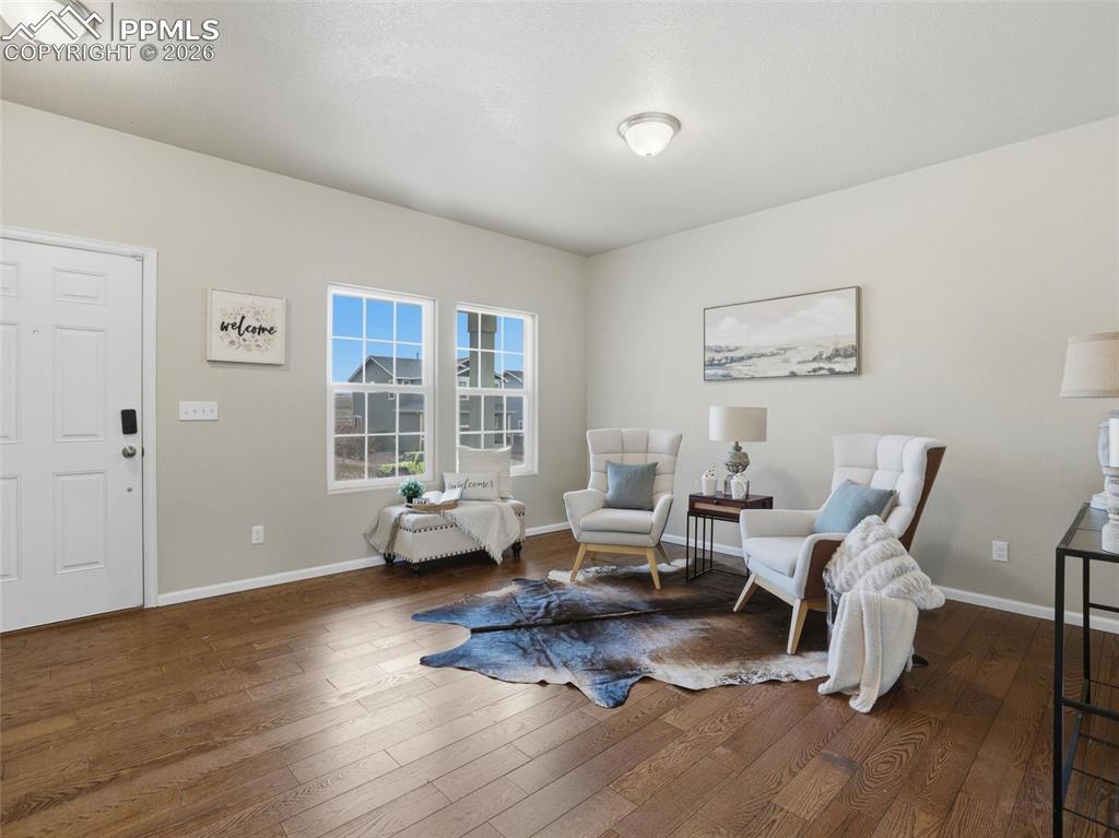 Living area with dark wood finished floors