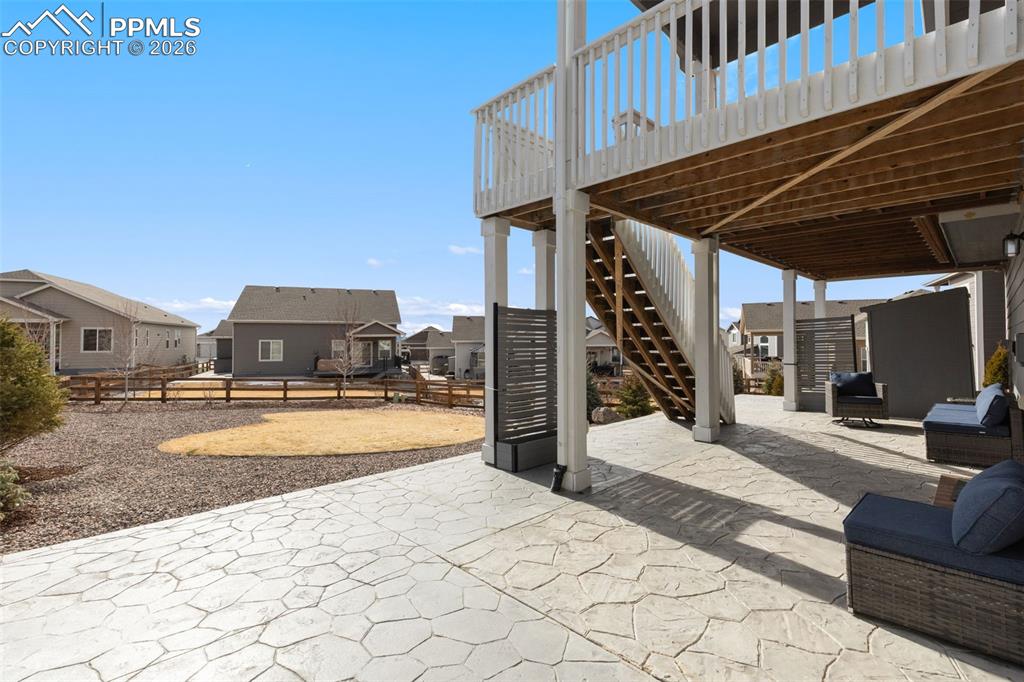 View of patio with a residential view and a deck
