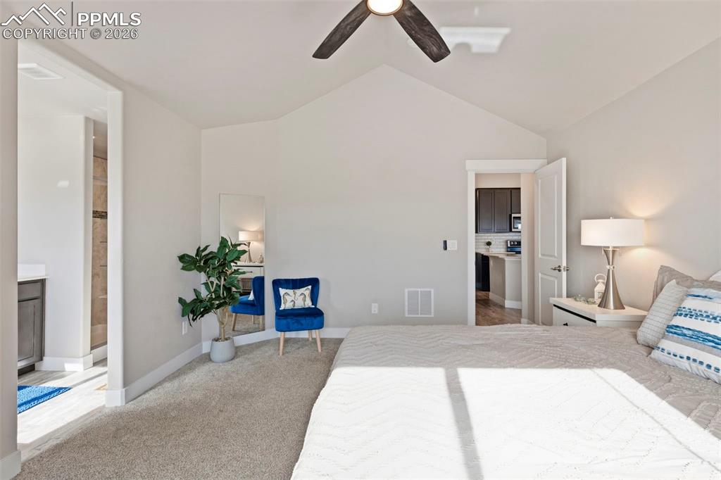 Bedroom with light carpet and ceiling fan