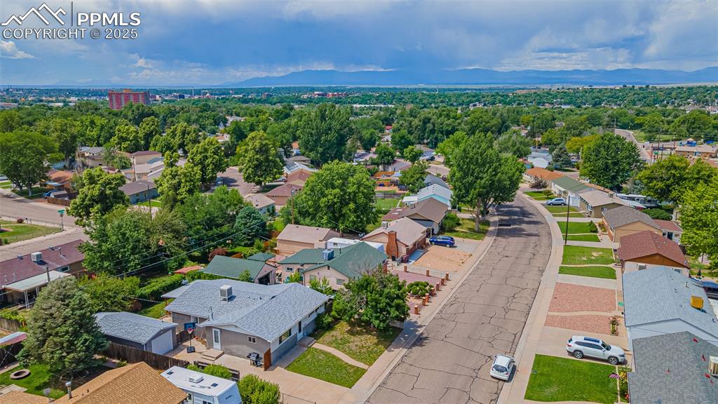 Aerial perspective of suburban area with a mountain backdrop