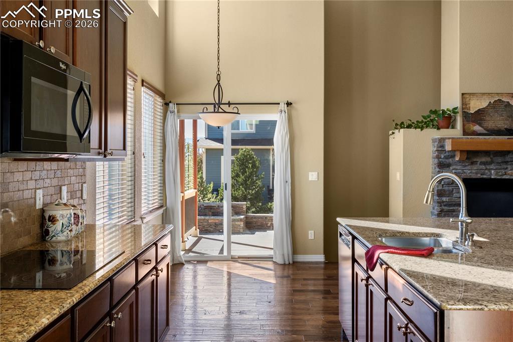 Kitchen walks out to back patios and yard. 