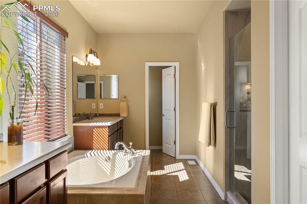 5 piece primary bath. Soaking tub, walk in shower and separate vanities. 