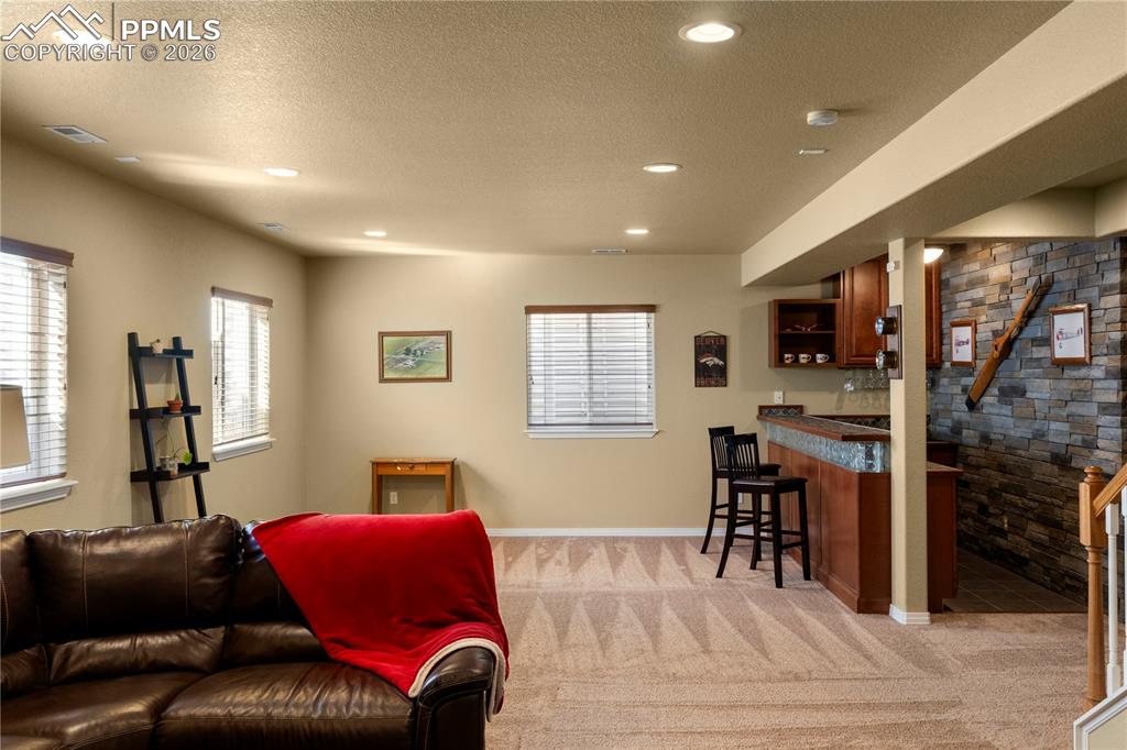Additional rec/game space as well as wet bar, great for entertaining and watching the big game. 