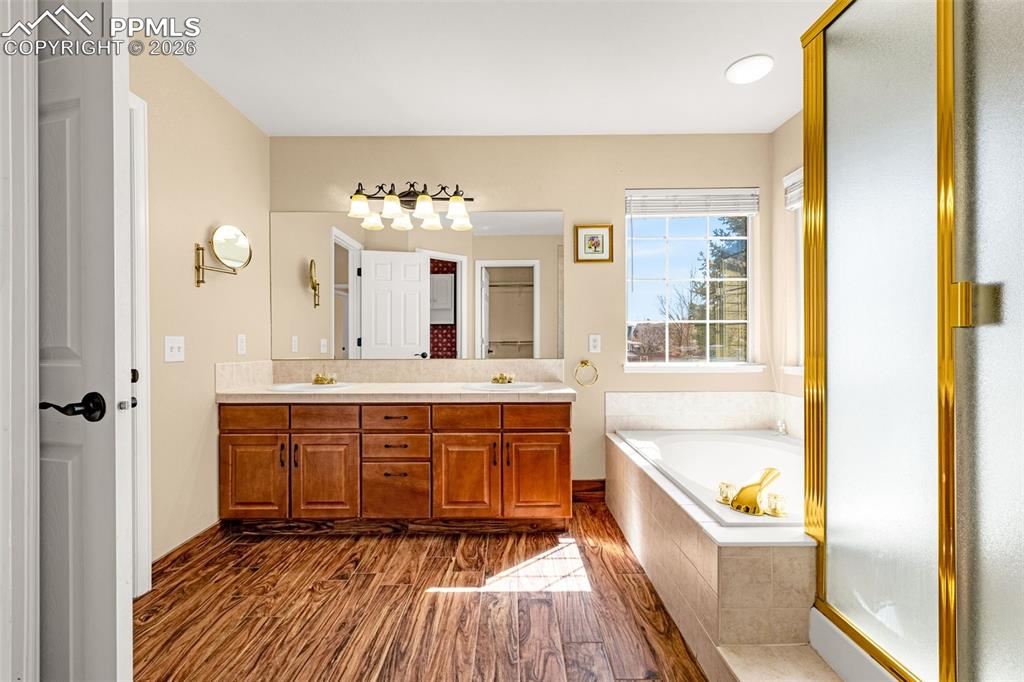 Wood look tile flooring sets off the natural cabinetry features