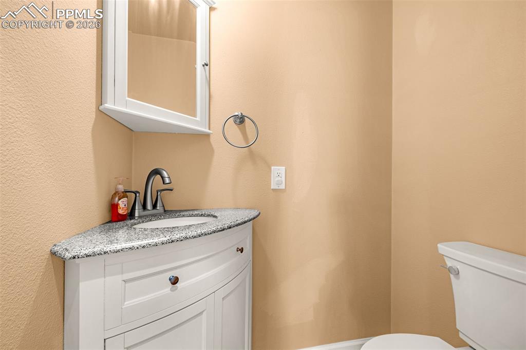 A convenient half bath off the living room/front hallway area